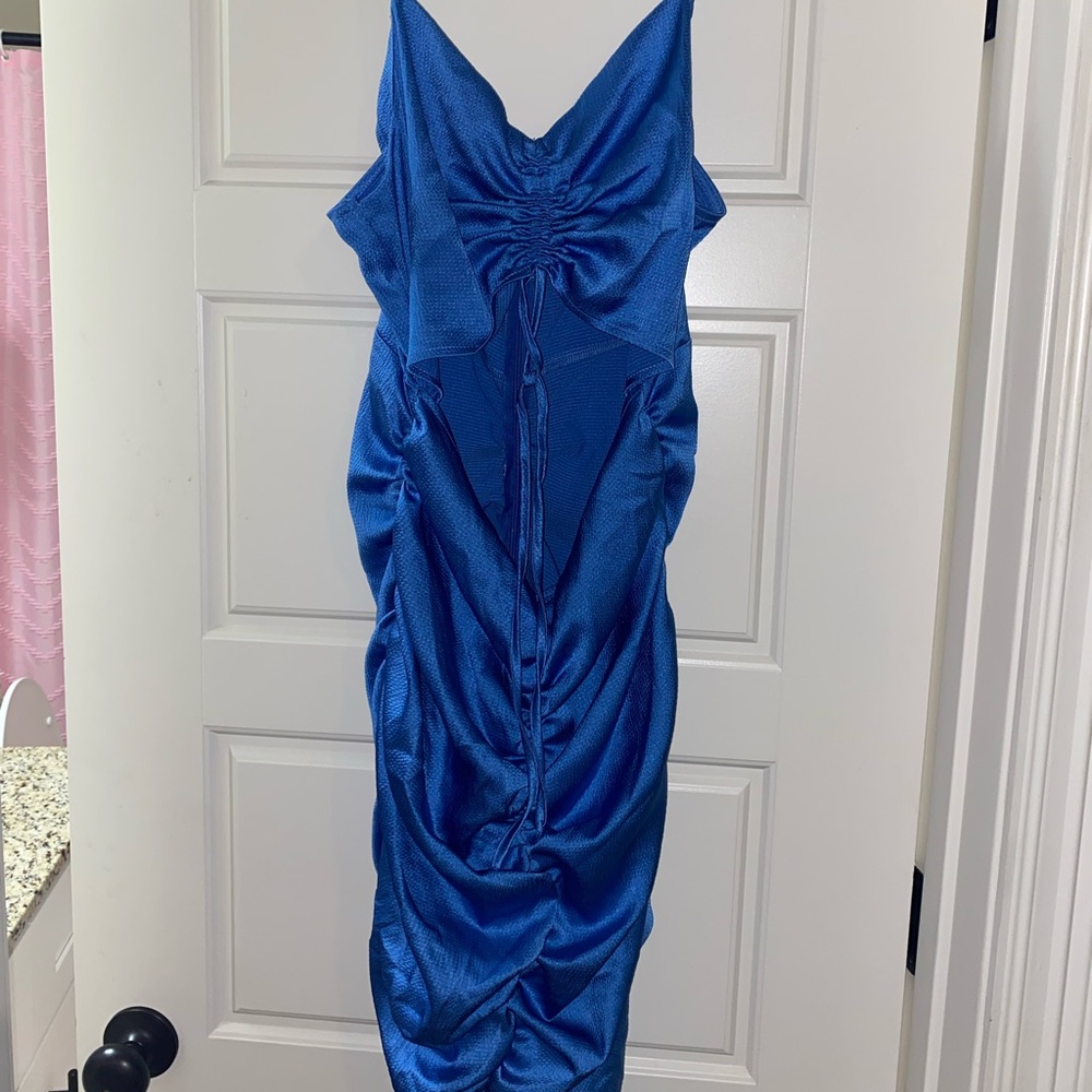 Blue spaghetti strap dress with sheer cut out.